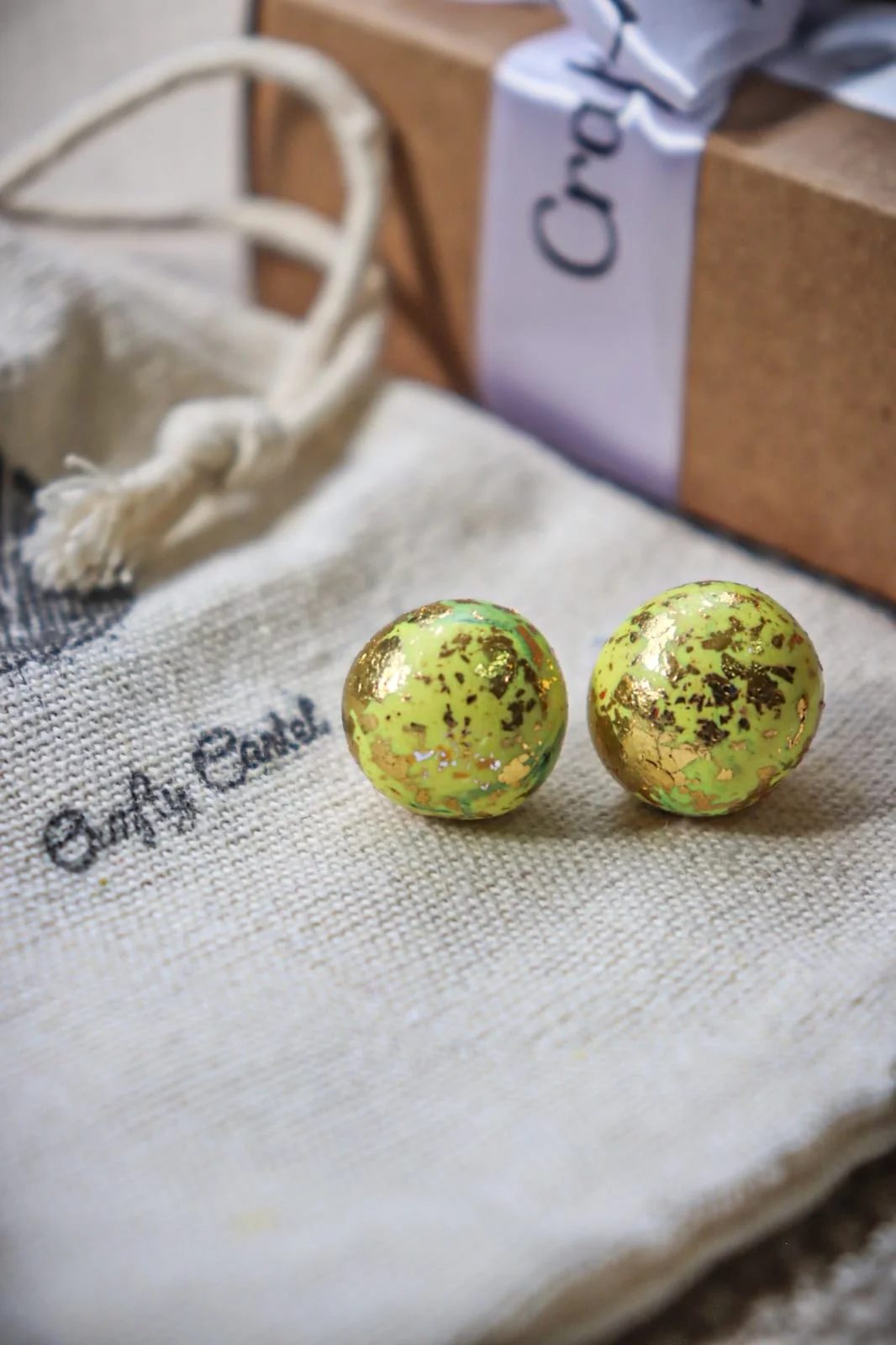 Asymmetrical polymer clay earrings with mixed textures